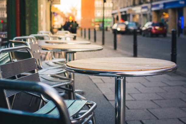 Cafe furniture on pavement Tables and chairs on the pavement outside a care. cafe stock pictures, royalty-free photos & images