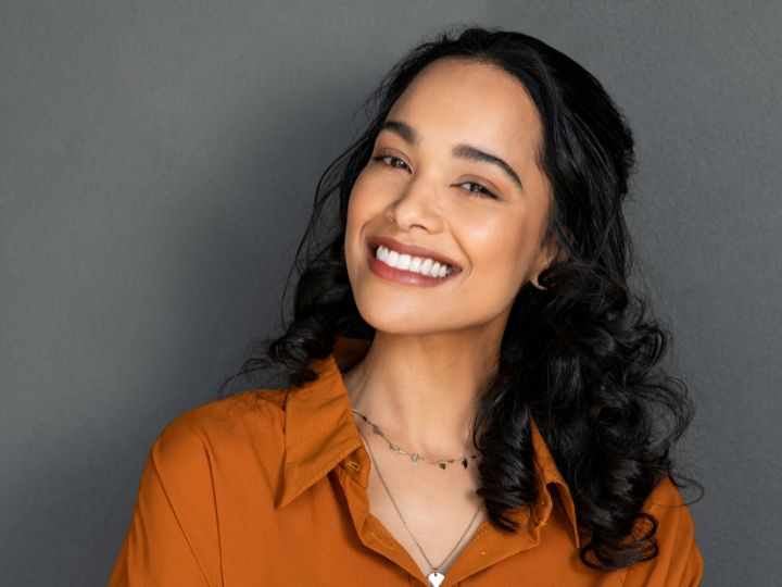 What are the main benefits of professional teeth whitening compared to over-the-counter products?