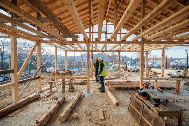 Construction workers in building site. Construction workers in building site of wooden house. building contractor stock pictures, royalty-free photos & images