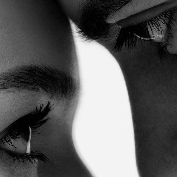 This may contain: a man and woman are looking at each other with their eyes close to one another