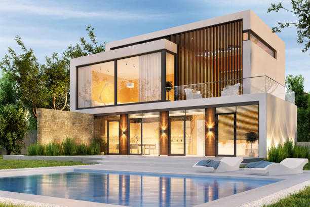 Evening view of a modern large house with swimming pool Evening view of a modern large white house with swimming pool Luxury villas  stock pictures, royalty-free photos & images