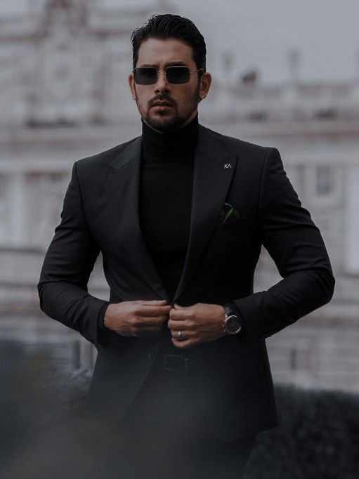 Clad in a **tailored black tuxedo**, every inch of him radiated authority, elegance, and enigma