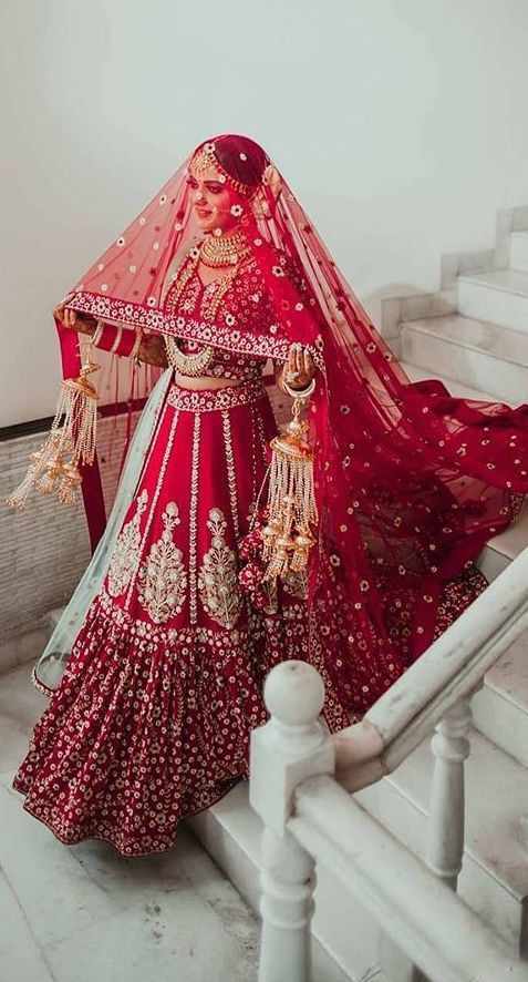 Dressed in a deep red lehenga, her jewelry gleaming under the lights, she looked like a vision straight out of a painting