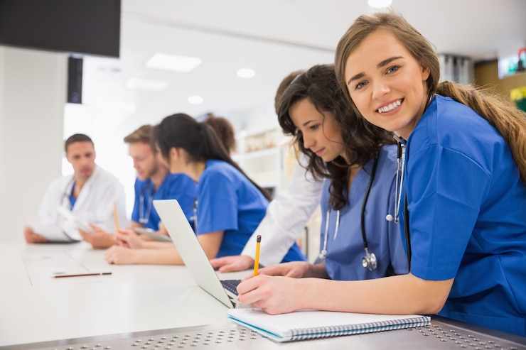 Medical student smiling at the camera during class