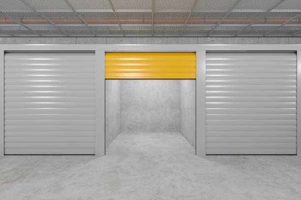 Front View Of Self Storage Units With Roller Doors. Empty Open Unit With Yellow Door Front View Of Self Storage Units With Roller Doors. Empty Open Unit With Yellow Door Garage door supply  stock pictures, royalty-free photos & images