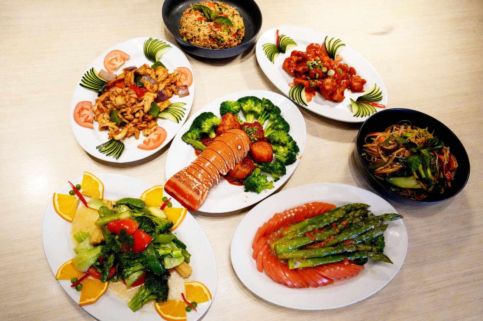Caption: a table topped with plates of different types of food