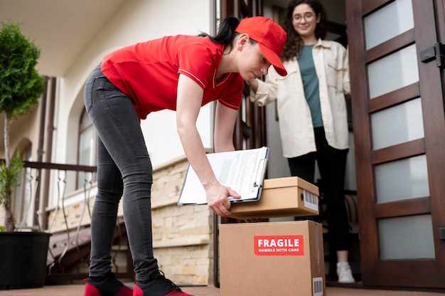 Full shot delivery woman with boxes