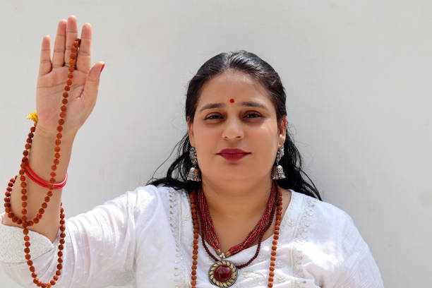 Female monk giving blessing Mid adult female monk of Indian ethnicity giving blessing portrait close up. Jyotish  stock pictures, royalty-free photos & images