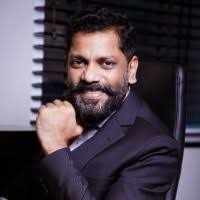 Dr Sunil Ambalavelil logo