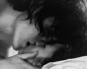 caressing her boobs.