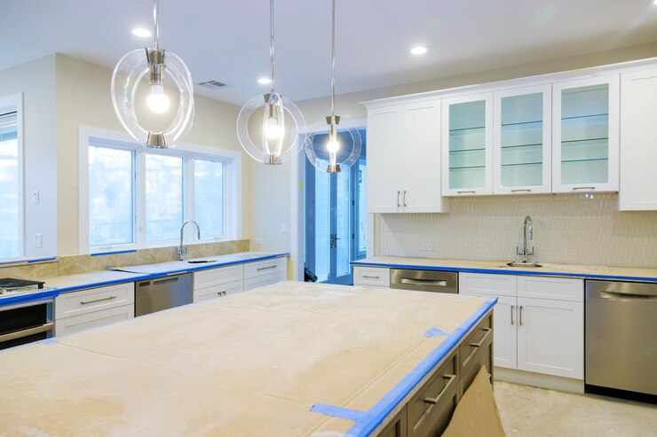 White of kitchen wooden cabinets with contemporary look of installation base for island in center