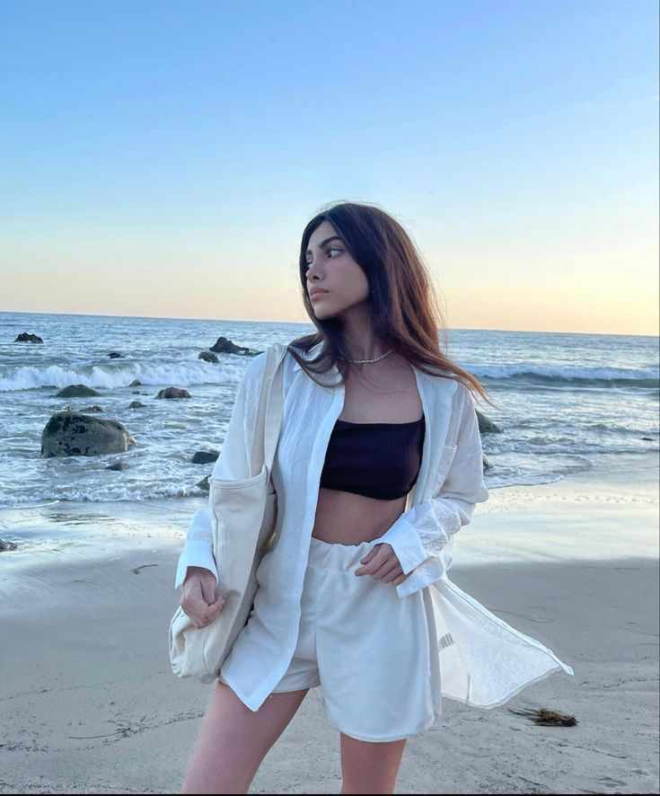 She waits for the wave to break, catches the sun just right, and clicks