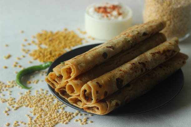 Daal paratha. Indian flatbread with lentils and spices. A protein rich version of Indian paratha Daal paratha. Indian flatbread with lentils and spices. A protein rich version of Indian paratha. Shot on white background Dhaba resturent stock pictures, royalty-free photos & images