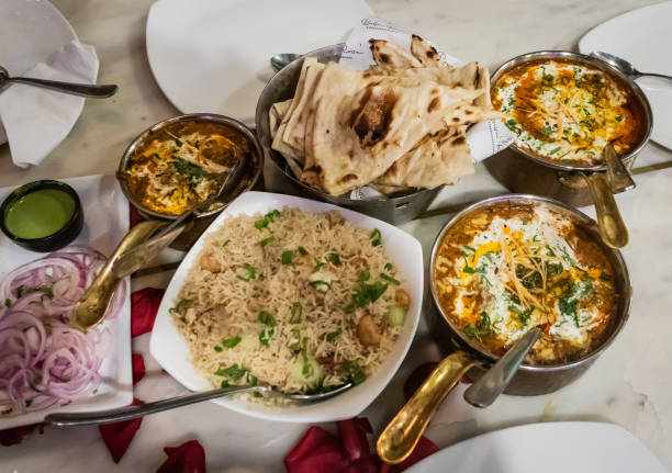 indian delicious food with many local dishes from top angle indian delicious food with many local dishes from top angle north indian best foods hotel stock pictures, royalty-free photos & images