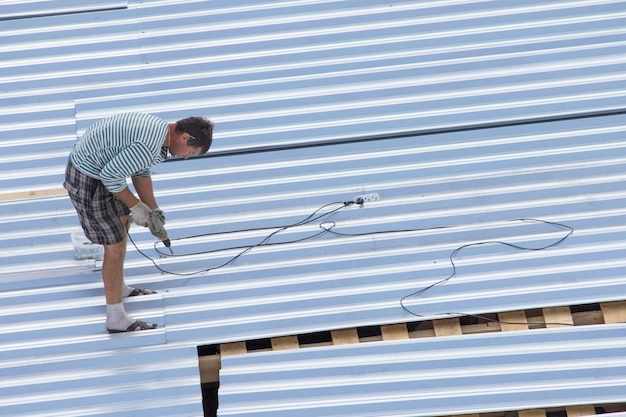 Workers building roof