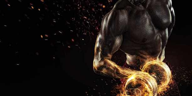 Creative Sport. Closeup portrait of professional bodybuilder with fire Sport and fitness men bodybuilder stock pictures, royalty-free photos & images