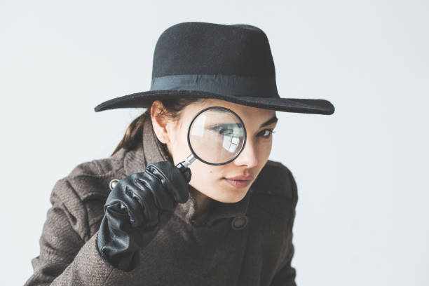 Woman with the magnifying glass Woman with the magnifying glass private detective stock pictures, royalty-free photos & images