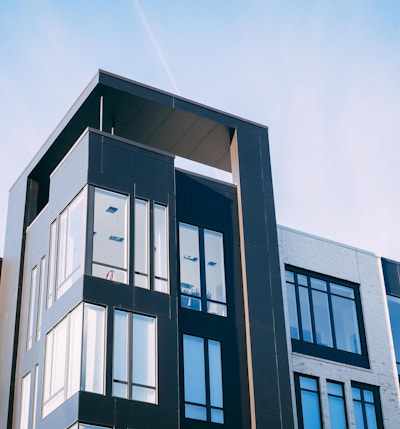 black and white cocnrete building low-angle photography