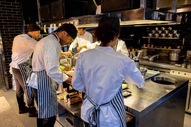 Group of chefs cooking together at a restaurant
