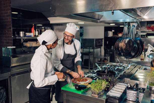 Chef is working on cooking training with his new employee
